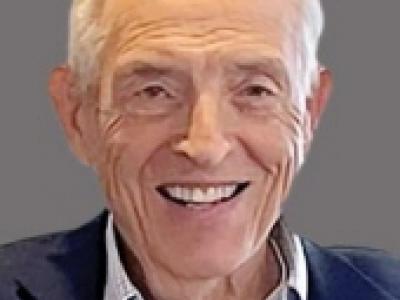 Headshot of older man with white hair