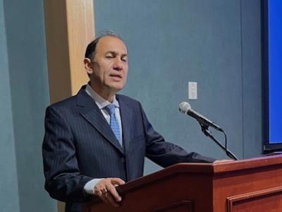 Dr. Hossein Kamaly at podium
